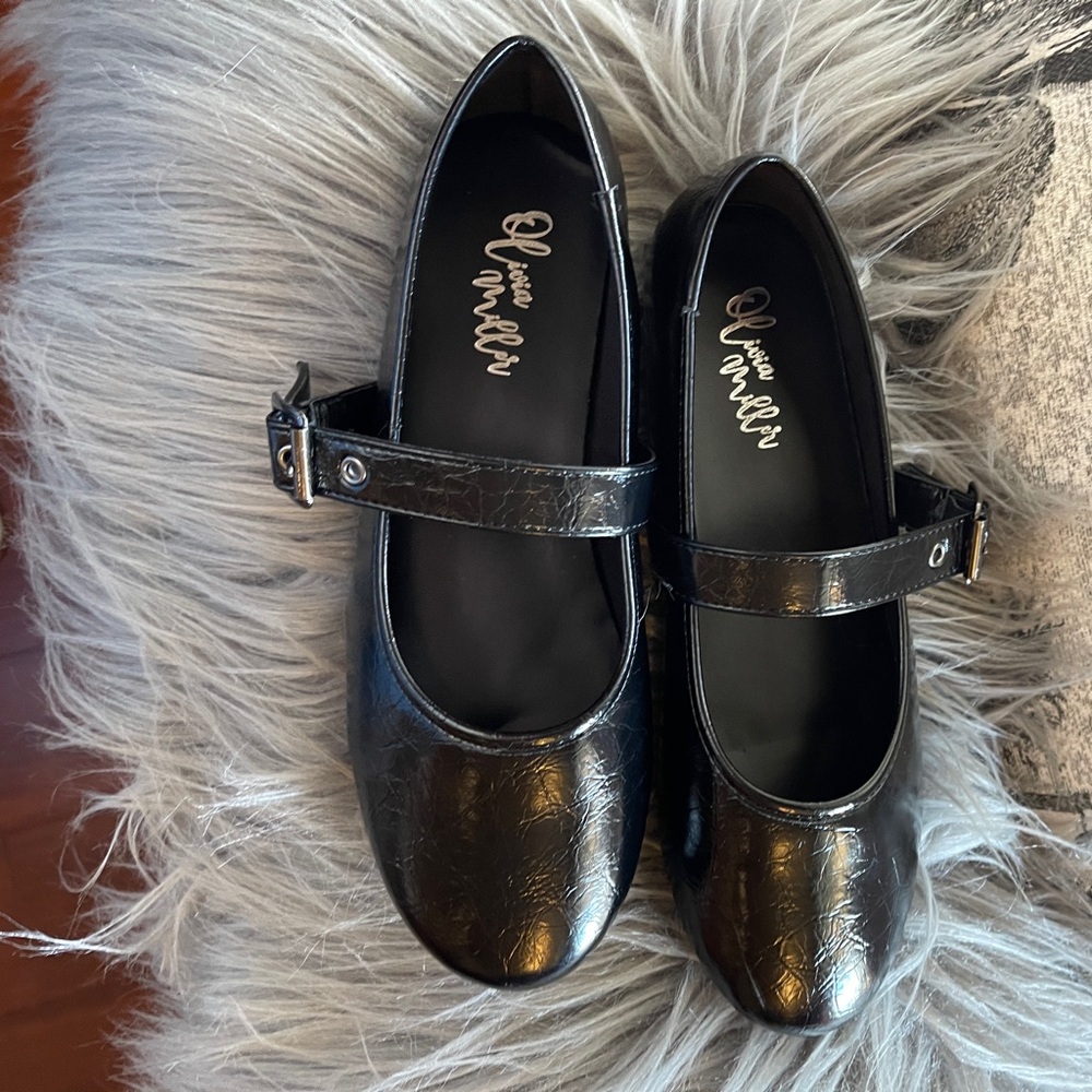 Olivia Miller Mary Jane Flats.  Patented black, buckle strap flats.